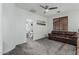 Neutral-toned bonus room or living room offers versatility with soft carpet and plenty of natural light at 13446 S 186Th Ave, Goodyear, AZ 85338
