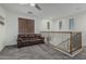Upstairs living space with plush carpet, comfortable seating, and abundant natural light at 13446 S 186Th Ave, Goodyear, AZ 85338