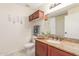 Bathroom featuring a granite vanity top, a toilet, and a tub-shower combo at 15252 N 100Th St # 1156, Scottsdale, AZ 85260