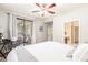 Bedroom featuring a ceiling fan, a sliding door to the outside, and a walk-in closet at 15252 N 100Th St # 1156, Scottsdale, AZ 85260