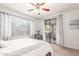 Cozy bedroom with a ceiling fan, a sliding door to the outside, and lots of natural light at 15252 N 100Th St # 1156, Scottsdale, AZ 85260