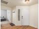 Bright foyer with wood-look floors leads to a bedroom and into the main living space at 15252 N 100Th St # 1156, Scottsdale, AZ 85260