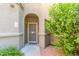 Inviting front entryway with security door and lush desert landscaping at 15252 N 100Th St # 1156, Scottsdale, AZ 85260