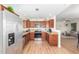 Charming kitchen with stainless steel appliances, granite counters, and an open view to the living area at 15252 N 100Th St # 1156, Scottsdale, AZ 85260