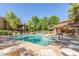 Community pool featuring lounge chairs, tables, and a well-maintained deck at 15252 N 100Th St # 1156, Scottsdale, AZ 85260