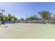 Community tennis court with net and lighting at 15252 N 100Th St # 1156, Scottsdale, AZ 85260