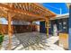 Outdoor patio with a pergola and string lights, creating a cozy entertainment space at 1527 E Sunnyslope Ln, Phoenix, AZ 85020