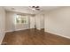 Large bedroom featuring wood-look floors, a ceiling fan, natural light and neutral color palette at 1527 E Sunnyslope Ln, Phoenix, AZ 85020