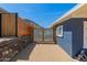 Side yard with wood and metal fence and desert landscaping, offering privacy and security for the property at 1527 E Sunnyslope Ln, Phoenix, AZ 85020