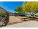 Well-maintained single-story home with desert landscaping, gravel driveway, stone accents, and a mountain view in the background at 1527 E Sunnyslope Ln, Phoenix, AZ 85020