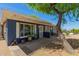 Charming home featuring attractive landscaping, desert plants and trees, against a mountain backdrop at 1527 E Sunnyslope Ln, Phoenix, AZ 85020