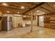 Interior featuring a fridge, sink, shelves, concrete floor and a door to the outside at 1527 E Sunnyslope Ln, Phoenix, AZ 85020