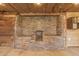 Interior featuring a stone wall and unfinishined drywall and wooden wall with lighting overhead at 1527 E Sunnyslope Ln, Phoenix, AZ 85020