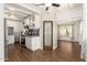Beautiful white kitchen with stainless appliances, stylish backsplash, pantry, and wood-look floors at 1527 E Sunnyslope Ln, Phoenix, AZ 85020