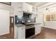 Updated kitchen featuring stainless steel range, granite counters and blue backsplash at 1527 E Sunnyslope Ln, Phoenix, AZ 85020
