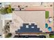 A view of a house roof with solar panels and an umbrella at 15704 W Taylor St, Goodyear, AZ 85338