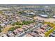 A high-angle view showcases an expansive community with various amenities and well-spaced homes at 15704 W Taylor St, Goodyear, AZ 85338