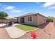 A lovely backyard offers a brick patio and a small artificial turf area at 15704 W Taylor St, Goodyear, AZ 85338