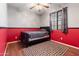 Bedroom with hardwood floors, ceiling fan, and natural light at 15704 W Taylor St, Goodyear, AZ 85338