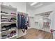 Spacious walk-in closet with ample storage, organized shelving, and bright lighting at 15704 W Taylor St, Goodyear, AZ 85338