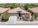 Charming single-story home featuring desert landscaping, covered entry, and a two-car garage at 15704 W Taylor St, Goodyear, AZ 85338