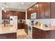 Well-equipped kitchen boasts ample cabinet space, modern appliances, and a functional layout for seamless meal preparation at 15704 W Taylor St, Goodyear, AZ 85338
