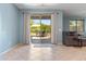 Inviting living room with sliding glass doors leading to a patio seating area at 15704 W Taylor St, Goodyear, AZ 85338