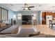 Cozy living room with large TV and a view into kitchen, perfect for entertaining and Gathering gatherings at 15704 W Taylor St, Goodyear, AZ 85338