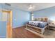 Comfortable main bedroom offering a cozy space with warm wood accents and natural light at 15704 W Taylor St, Goodyear, AZ 85338