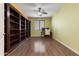Large office with built in shelving, neutral colors, and natural light at 15704 W Taylor St, Goodyear, AZ 85338