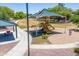 Exterior view of a community park playground with slides, swings, and picnic tables at 15704 W Taylor St, Goodyear, AZ 85338