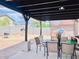 Backyard patio area features a covered patio and brick fence at 1616 W Burgess Ln, Phoenix, AZ 85041
