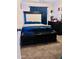 Comfortable bedroom with dark furniture, plush carpet and large windows at 1616 W Burgess Ln, Phoenix, AZ 85041