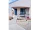 Inviting front porch area with desert landscaping, metal railing and covered porch at 1616 W Burgess Ln, Phoenix, AZ 85041