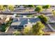 Aerial view showcases a charming home with a gray roof, fenced yard and verdant landscaping, offering privacy at 1644 W Thunderbird Rd, Phoenix, AZ 85023