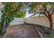 A simple backyard featuring two mature trees provides beauty to this outdoor space at 1644 W Thunderbird Rd, Phoenix, AZ 85023
