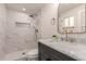 Modern bathroom features a marble-tiled shower with niche, sleek fixtures, and elegant vanity at 1644 W Thunderbird Rd, Phoenix, AZ 85023