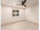 Bedroom with natural light from the window, recessed lights, fan, and wood-look flooring at 1644 W Thunderbird Rd, Phoenix, AZ 85023
