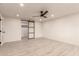 Bright bedroom with recessed lights and a modern ceiling fan, featuring a stylish sliding closet door at 1644 W Thunderbird Rd, Phoenix, AZ 85023
