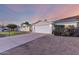 Charming home featuring a spacious driveway, two-car garage, and a manicured front yard at 1644 W Thunderbird Rd, Phoenix, AZ 85023