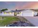 Charming single-story home with a well-manicured lawn, attached two-car garage and mountain backdrop at 1644 W Thunderbird Rd, Phoenix, AZ 85023