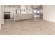 Open-concept kitchen featuring custom island design, stainless steel appliances, and recessed lighting at 1644 W Thunderbird Rd, Phoenix, AZ 85023