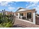 Spacious backyard with desert landscaping and covered patio area, ideal for outdoor living and relaxation at 17611 W Ingleside Dr, Surprise, AZ 85374