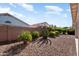 Backyard featuring desert landscaping and a privacy wall, creating a secluded outdoor space at 17611 W Ingleside Dr, Surprise, AZ 85374