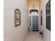 Inviting front entryway featuring textured walls and a decorative iron art piece at 17611 W Ingleside Dr, Surprise, AZ 85374