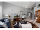 Comfortable living room with a ceiling fan and a cozy blue sofa at 17611 W Ingleside Dr, Surprise, AZ 85374