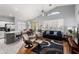 Bright living space featuring an open floor plan with a combined kitchen and living area at 17611 W Ingleside Dr, Surprise, AZ 85374