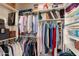Organized walk-in closet offers ample storage with shelving and hanging rods at 17611 W Ingleside Dr, Surprise, AZ 85374