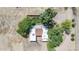 Aerial view of a charming property with lush greenery, outbuildings, and mature trees at 17705 E Canyon Way, Gilbert, AZ 85298