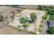 Aerial view of property highlighting the expansive lot, outbuildings, mature trees and landscaping at 17705 E Canyon Way, Gilbert, AZ 85298